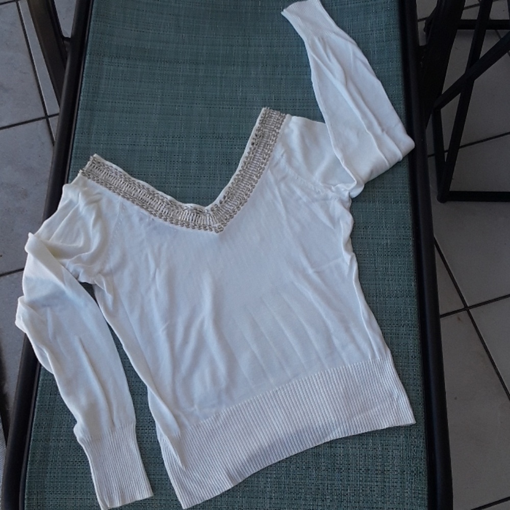Crisp white sweater with silver beats